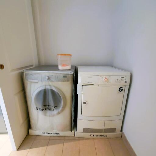 Compact laundry room with modern appliances