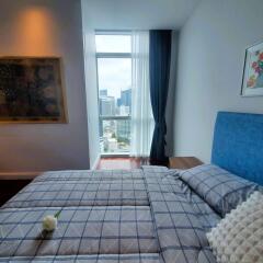 Modern bedroom with city skyline view