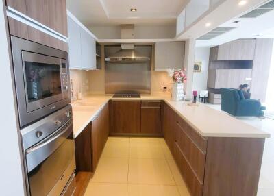 Modern kitchen with wooden cabinets and built-in appliances