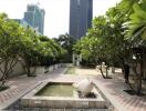 Tranquil garden courtyard in an urban environment with lush greenery and water features