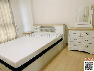 Bright and well-furnished bedroom with ample storage