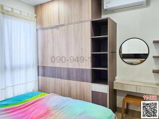 Modern bedroom with built-in wardrobe and air conditioning