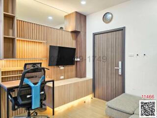 Modern home office with wooden shelving and desk setup