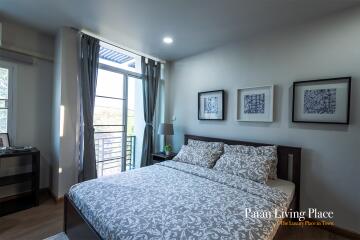 Cozy and well-furnished bedroom with ample natural light