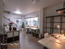 Modern spacious living room with dining area and staircase