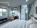 Spacious and elegantly furnished bedroom with large windows and modern decor