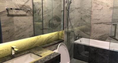 Modern bathroom with marble walls and premium fixtures