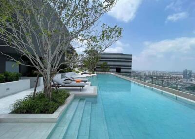 Luxurious rooftop swimming pool with city skyline view