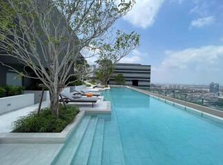 Luxurious rooftop swimming pool with city skyline view