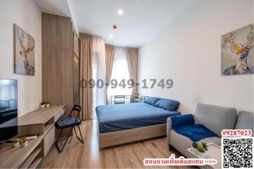 Modern bedroom with ample natural light and contemporary furnishings