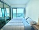 Bright bedroom with ocean view and balcony access