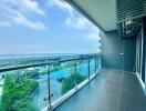 Luxurious balcony overlooking the ocean with a swimming pool view