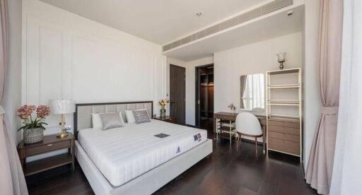 Elegant and well-furnished modern bedroom with ample sunlight