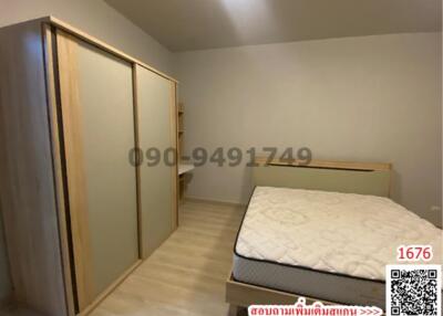 Cozy bedroom with large bed and spacious wardrobe