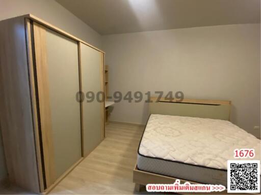 Cozy bedroom with large bed and spacious wardrobe