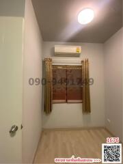 Compact bedroom with minimalistic design and air conditioning unit