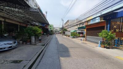 Urban street view with residential and commercial buildings