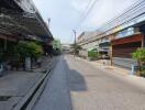 Urban street view with residential and commercial buildings