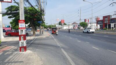 Urban street scene with commercial buildings and traffic