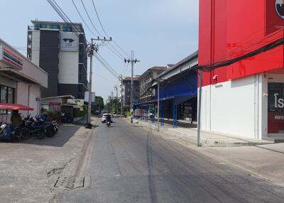 Urban street view showcasing shops and road