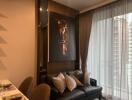 Modern living room with a large horse artwork, black leather sofa, and sheer curtains