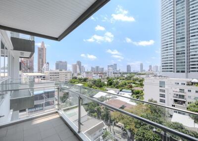 Spacious balcony with cityscape view in a modern apartment