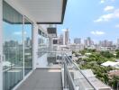 Spacious balcony with city view and clear sky