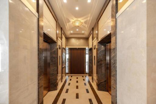 Luxurious building hallway with elegant marble flooring and sophisticated decor