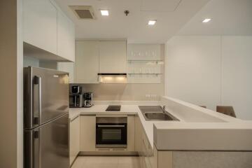 Modern kitchen with stainless steel appliances and white cabinets