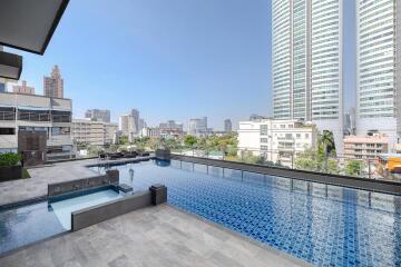 Luxurious rooftop swimming pool with city skyline view