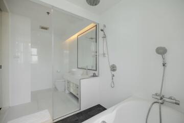 Modern bathroom with bathtub and glass shower