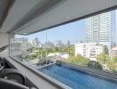 Luxurious indoor swimming pool with panoramic cityscape view