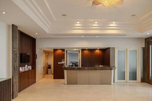 Spacious and modern lobby with elegant lighting and wooden accents