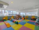 Colorful indoor children's playroom with toys and safe play equipment