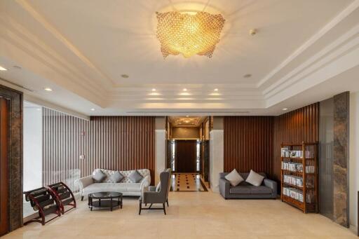 Spacious and elegant living room with modern furnishings and luxurious decor