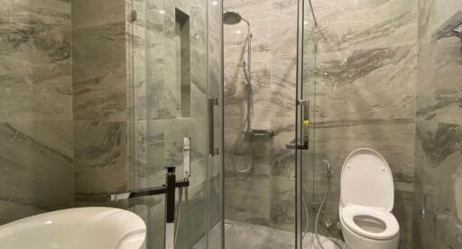 Modern bathroom with marble tiling