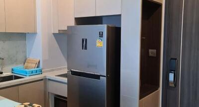 Modern kitchen with stainless steel appliances and white cabinetry