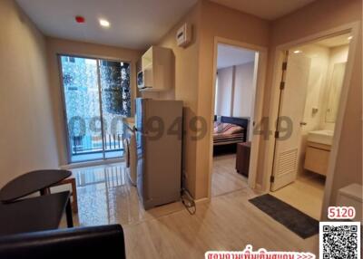 Compact bedroom with adjoining bathroom, modern minimalistic furniture, and a view of the urban area