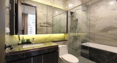 Modern bathroom with marble walls and stylish fixtures