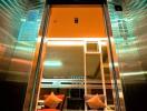 Modern elevator lobby with stylish chairs and decorative lighting