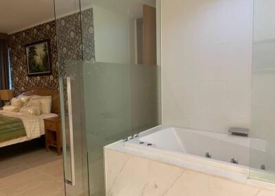 Elegant bathroom with jacuzzi tub adjacent to bedroom