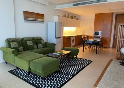 Spacious open-plan living room with adjacent kitchen