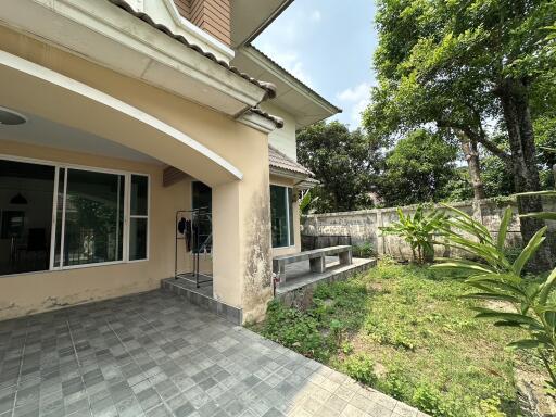 Exterior view of a house with patio and garden