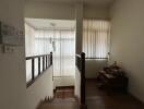 bright and elegant stairway landing with natural light