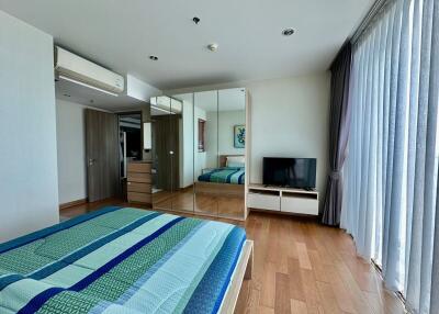Spacious bedroom with modern design and ample natural light