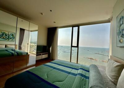 Spacious bedroom overlooking the sea with large windows