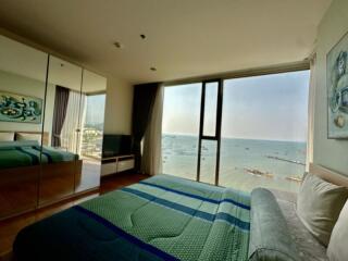 Spacious bedroom overlooking the sea with large windows