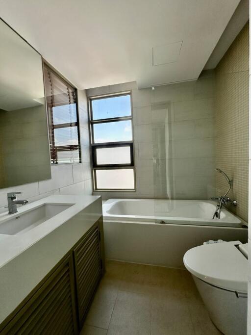 Spacious modern bathroom with large window