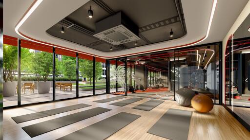 Modern gym interior with large windows and natural light