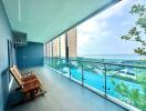 Spacious balcony with ocean view and swimming pool